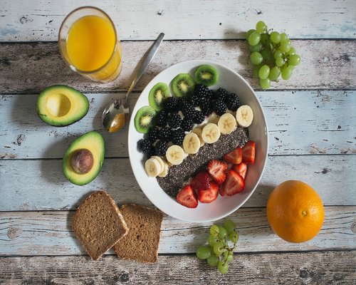 Delicious breakfast bowl with chia seeds, nuts, and fresh berries
